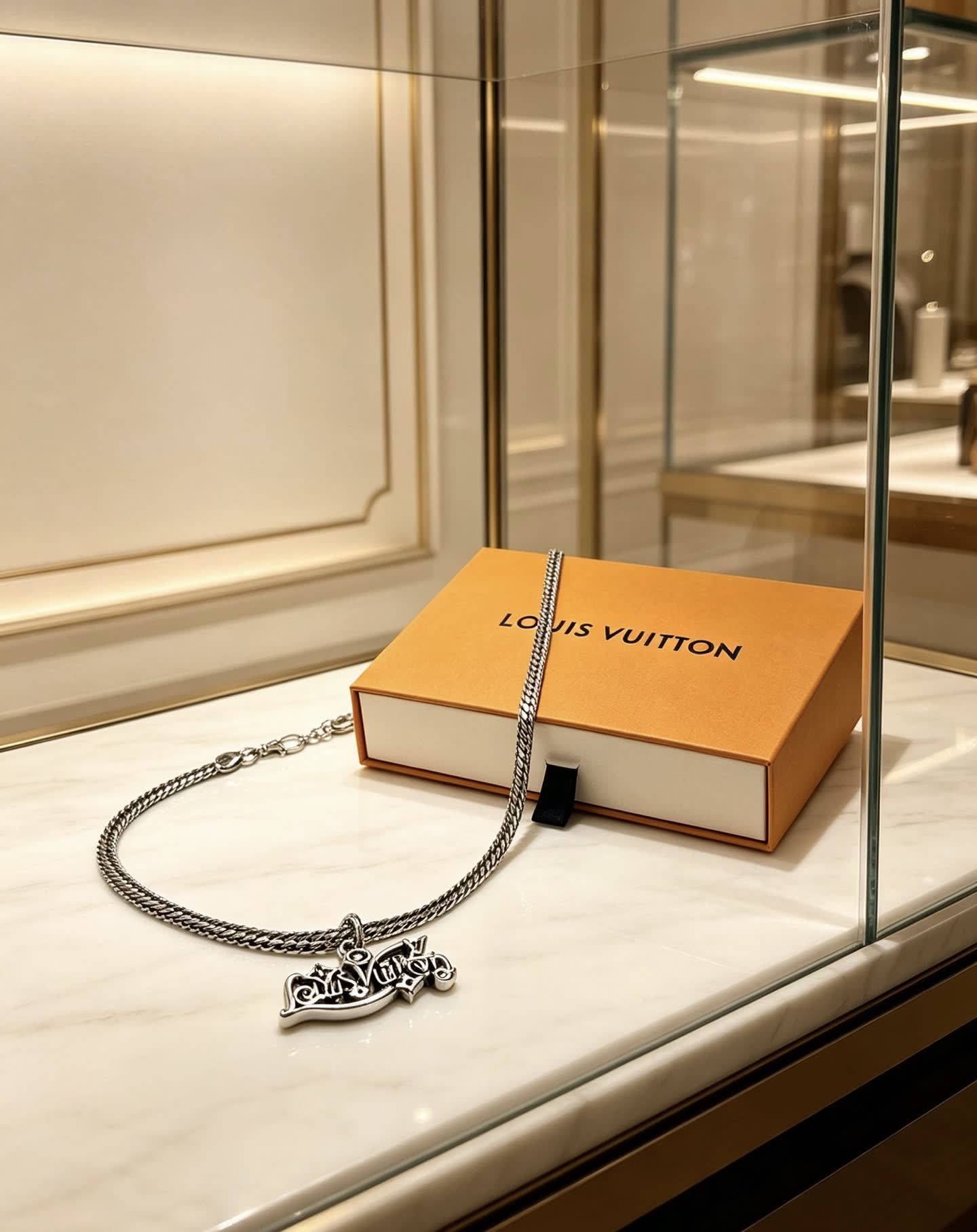 Louis Vuitton Silver Chain with Logo Pendant